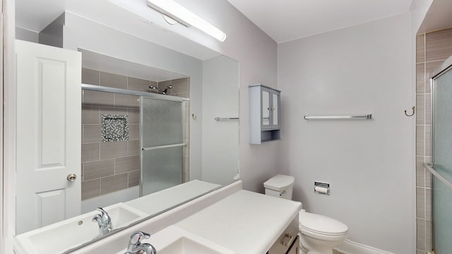 353 Marian Ct, Bolingbrook, IL 60440 - bathroom featuring tiled shower, toilet, and vanity