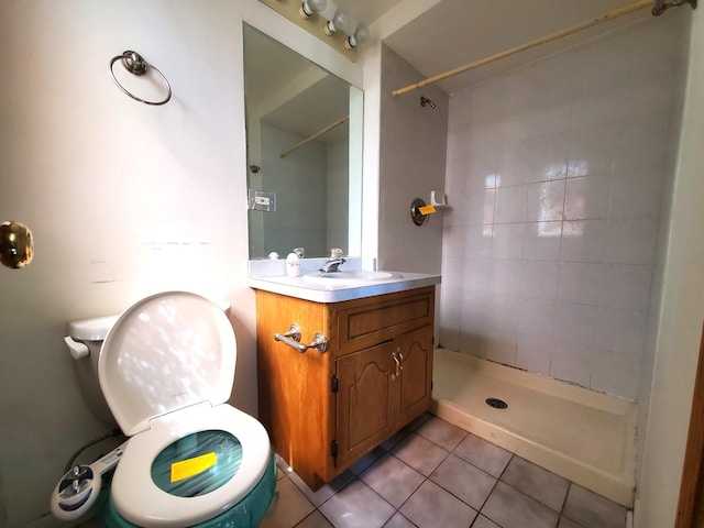 full bath featuring toilet, a shower stall, tile patterned flooring, and vanity