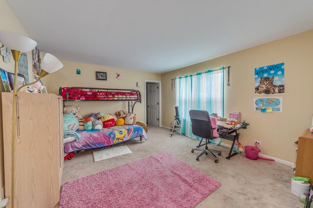bedroom with carpet flooring and baseboards