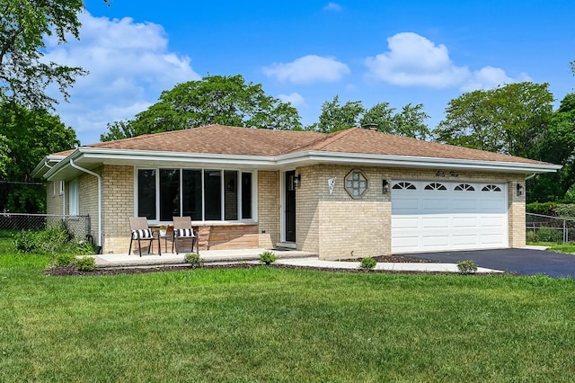 6340 Willow Springs Rd, La Grange Highlands, IL 60525 - ranch-style house with brick siding, an attached garage, and asphalt driveway