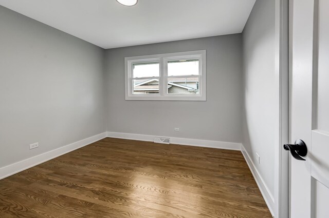6340 Willow Springs Rd, La Grange Highlands, IL 60525 - spare room featuring dark wood-type flooring and baseboards