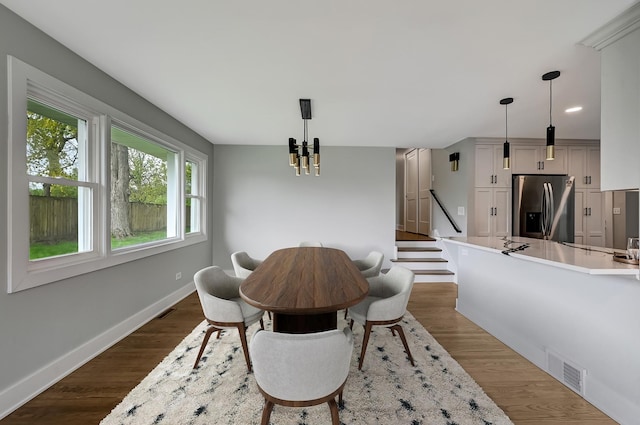 6340 Willow Springs Rd, La Grange Highlands, IL 60525 - dining area with a chandelier, dark wood-type flooring, baseboards, and stairway
