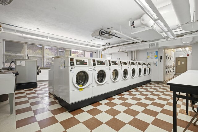 6301 N Sheridan Rd Unit 12C, Chicago, IL 60660 - shared laundry featuring separate washer and dryer and tile patterned floors
