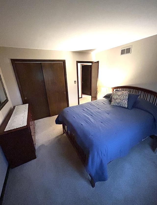 carpeted bedroom with visible vents