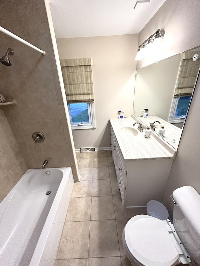 bathroom featuring toilet, visible vents, tile patterned flooring, and vanity
