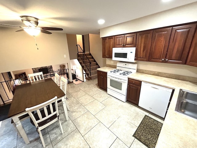 kitchen featuring recessed lighting, white appliances, ceiling fan, a sink, and light countertops