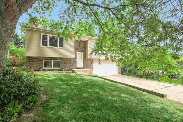 3110 Still Hill Dr, Mchenry, IL 60050 - bi-level home with brick siding, a chimney, and driveway
