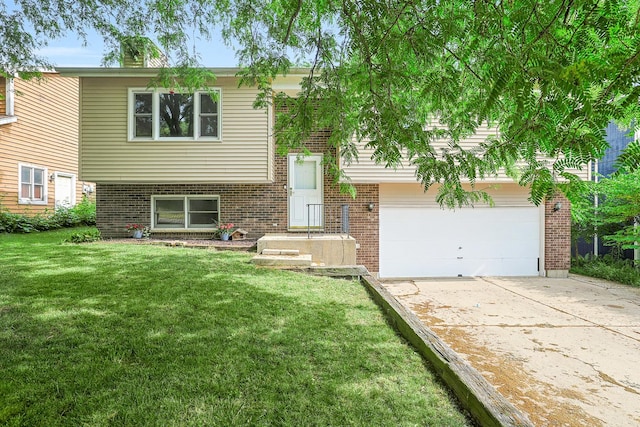 3110 Still Hill Dr, Mchenry, IL 60050 - split foyer home with concrete driveway, a front lawn, brick siding, and an attached garage