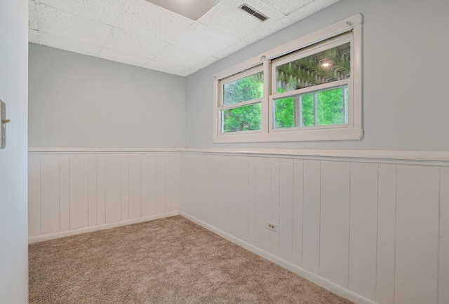 3110 Still Hill Dr, Mchenry, IL 60050 - empty room featuring wainscoting, a drop ceiling, and carpet floors