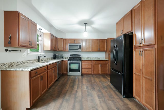 3110 Still Hill Dr, Mchenry, IL 60050 - kitchen with stainless steel appliances, dark wood finished floors, brown cabinetry, light stone counters, and decorative light fixtures