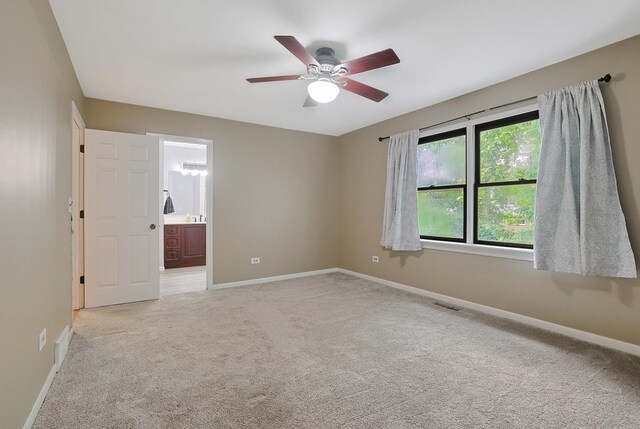 3110 Still Hill Dr, Mchenry, IL 60050 - spare room with light carpet and a ceiling fan
