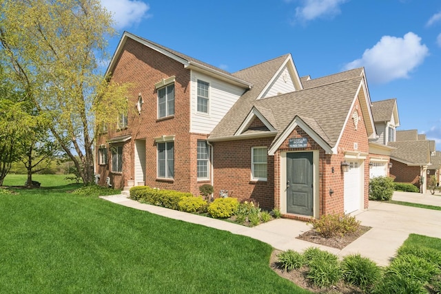 15 Red Tail Dr, Hawthorn Woods, IL 60047 - view of front of house with driveway, a front lawn, brick siding, an attached garage, and roof with shingles