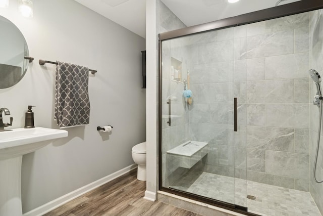 15 Red Tail Dr, Hawthorn Woods, IL 60047 - bathroom featuring toilet, wood finished floors, baseboards, and a stall shower