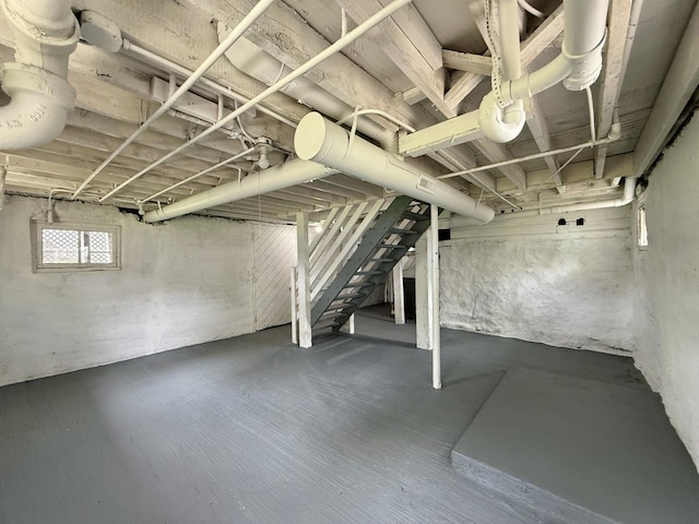 basement featuring stairs