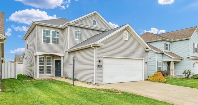 view of front facade featuring driveway, an attached garage, and a shingled roof