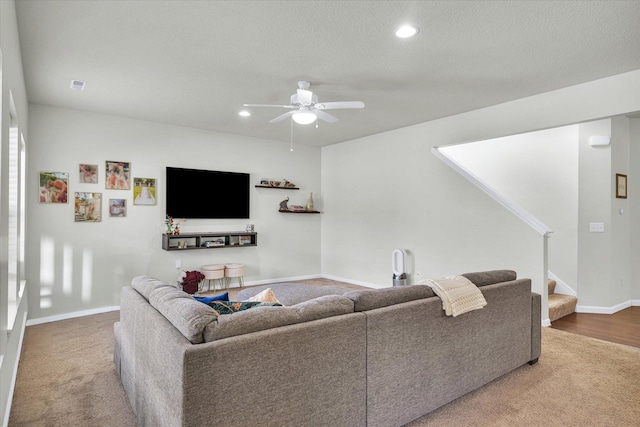 carpeted living room featuring a ceiling fan, stairs, recessed lighting, and baseboards