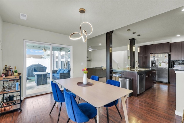 dining space with dark wood-style floors, ceiling fan, and recessed lighting