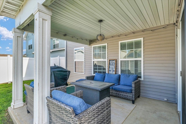 view of patio featuring fence, an outdoor hangout area, and area for grilling