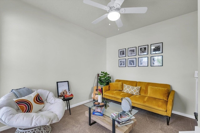 carpeted living room featuring baseboards and ceiling fan
