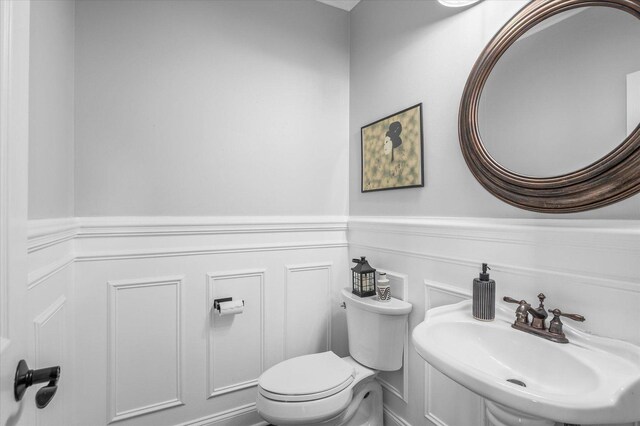 1759 Baybrook Ln, Naperville, IL 60564 - half bath with a sink, a wainscoted wall, toilet, and a decorative wall