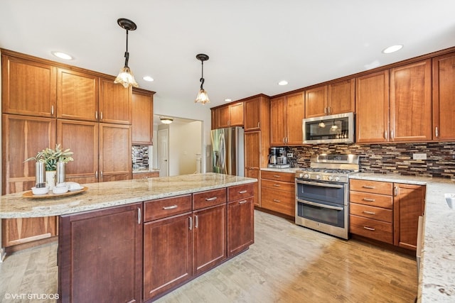 701 N Coolidge Ave, Palatine, IL 60067 - kitchen with appliances with stainless steel finishes, backsplash, light wood-style floors, pendant lighting, and recessed lighting
