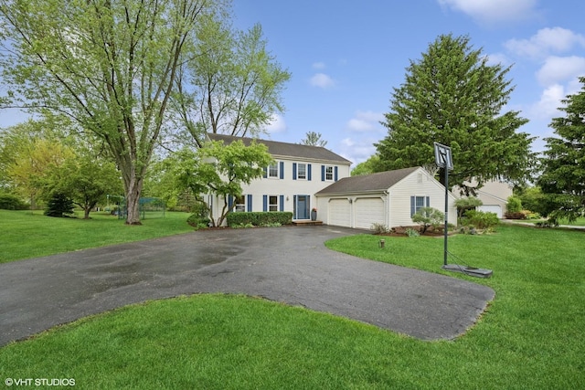 26 Alice Ln, Lake Barrington, IL 60010 - colonial inspired home with asphalt driveway and a front yard