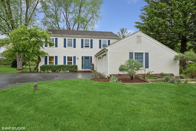 26 Alice Ln, Lake Barrington, IL 60010 - colonial-style house featuring driveway, a garage, and a front lawn