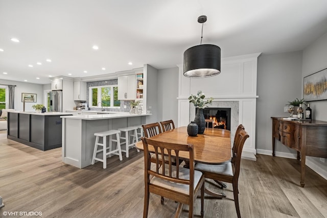 26 Alice Ln, Lake Barrington, IL 60010 - dining space with plenty of natural light, light wood-style flooring, a fireplace, and recessed lighting