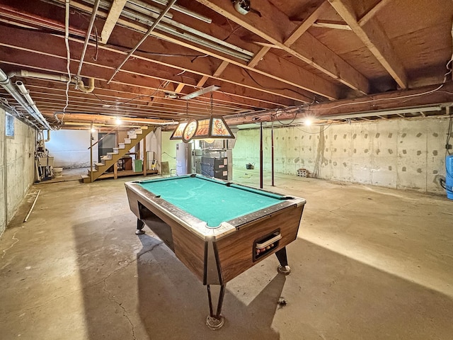 recreation room featuring water heater, billiards, and concrete flooring