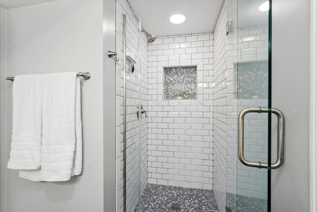 full bathroom with a stall shower and recessed lighting