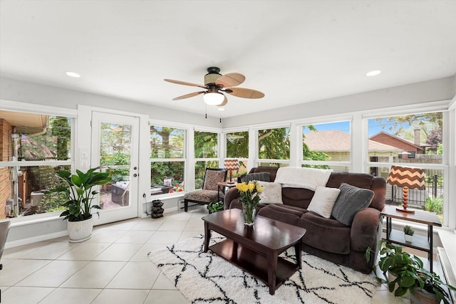 sunroom featuring tile patterned flooring, plenty of natural light, and recessed lighting