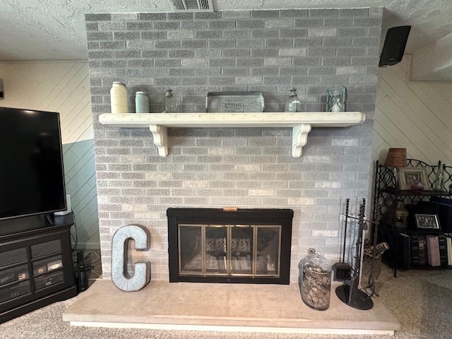 660 Londonberry Ln, Bolingbrook, IL 60440 - detailed view of a brick fireplace, a textured ceiling, and carpet flooring