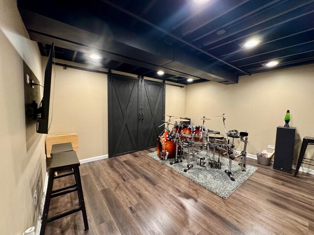 660 Londonberry Ln, Bolingbrook, IL 60440 - interior space featuring wood finished floors, a barn door, and baseboards