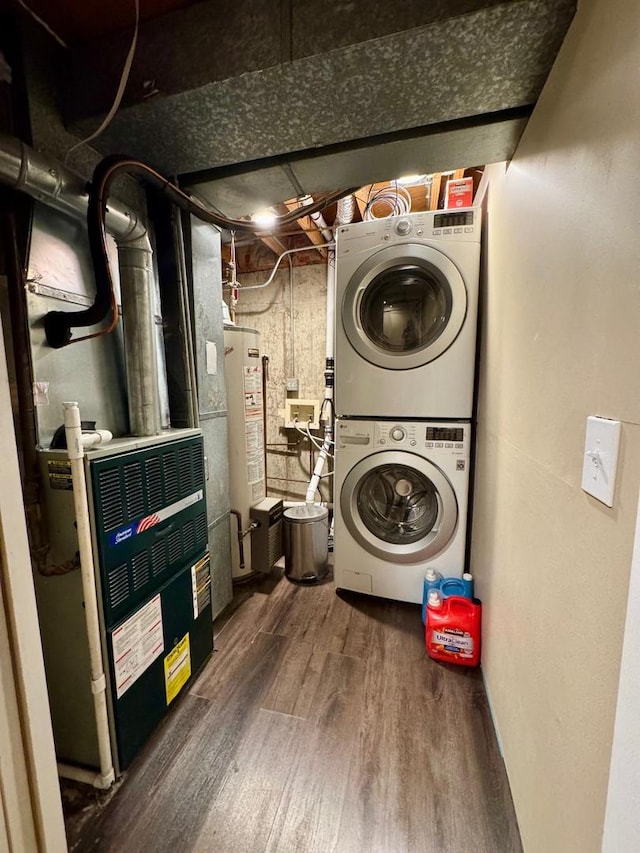660 Londonberry Ln, Bolingbrook, IL 60440 - laundry room featuring stacked washer / dryer, gas water heater, dark wood-style flooring, and heating unit