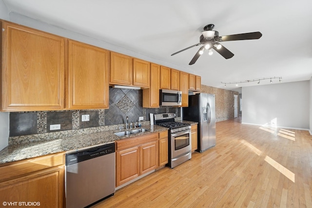 4736 S Saint Lawrence Ave Unit 1S, Chicago, IL 60615 - kitchen with appliances with stainless steel finishes, a ceiling fan, light wood-style floors, and decorative backsplash