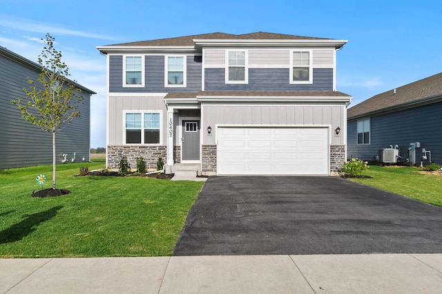 10407 Morse Pl, Crown Point, IN 46307 - view of front of home featuring board and batten siding, an attached garage, driveway, and stone siding
