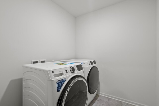 10407 Morse Pl, Crown Point, IN 46307 - clothes washing area featuring washer and dryer, laundry area, and baseboards