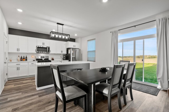 10407 Morse Pl, Crown Point, IN 46307 - dining space with recessed lighting and wood finished floors