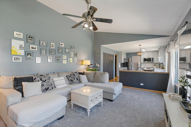 10134 Ashley St, Huntley, IL 60142 - living area featuring high vaulted ceiling, a ceiling fan, and carpet floors