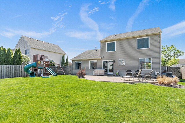 10134 Ashley St, Huntley, IL 60142 - back of house with a patio and a playground