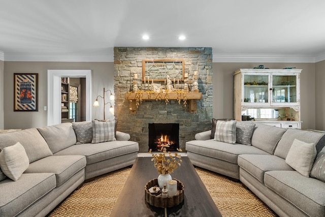 living room with recessed lighting, a fireplace, and crown molding