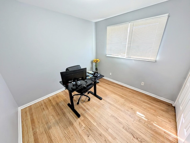 office featuring baseboards and wood finished floors