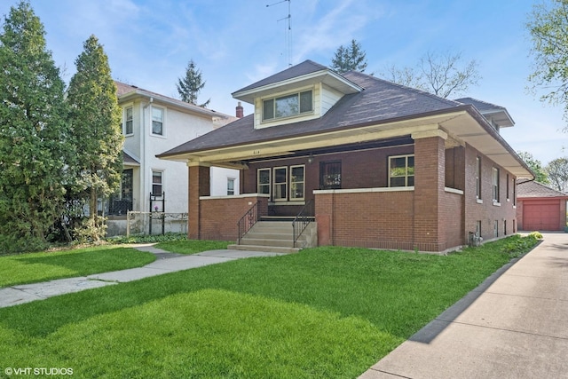 bungalow-style home featuring a front yard, a porch, and brick siding