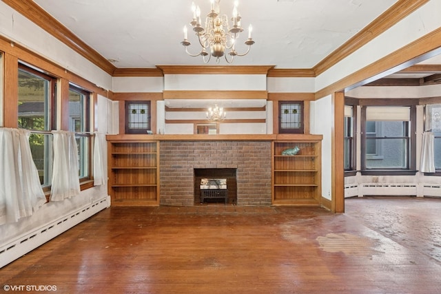 unfurnished living room with a chandelier, crown molding, and baseboard heating