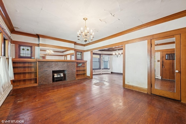 unfurnished living room with hardwood / wood-style flooring, a baseboard heating unit, ornamental molding, a chandelier, and a brick fireplace