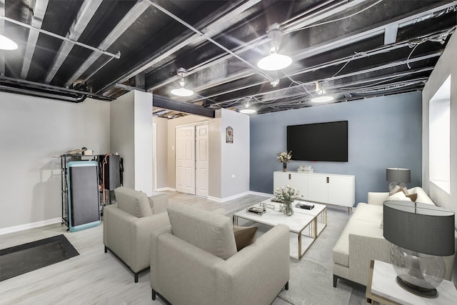 living room with wood finished floors and baseboards