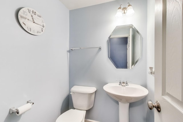 half bath featuring toilet