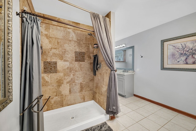 bathroom with vanity, tile patterned floors, and a stall shower