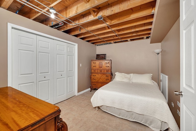 bedroom featuring a closet and light tile patterned floors