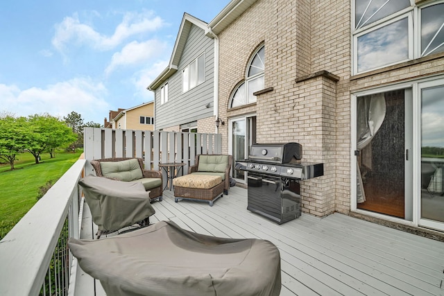 wooden terrace with a grill